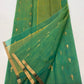 Close-up of Sea Green Chanderi Katan Silk saree showing fine gold-toned buttas woven along the body