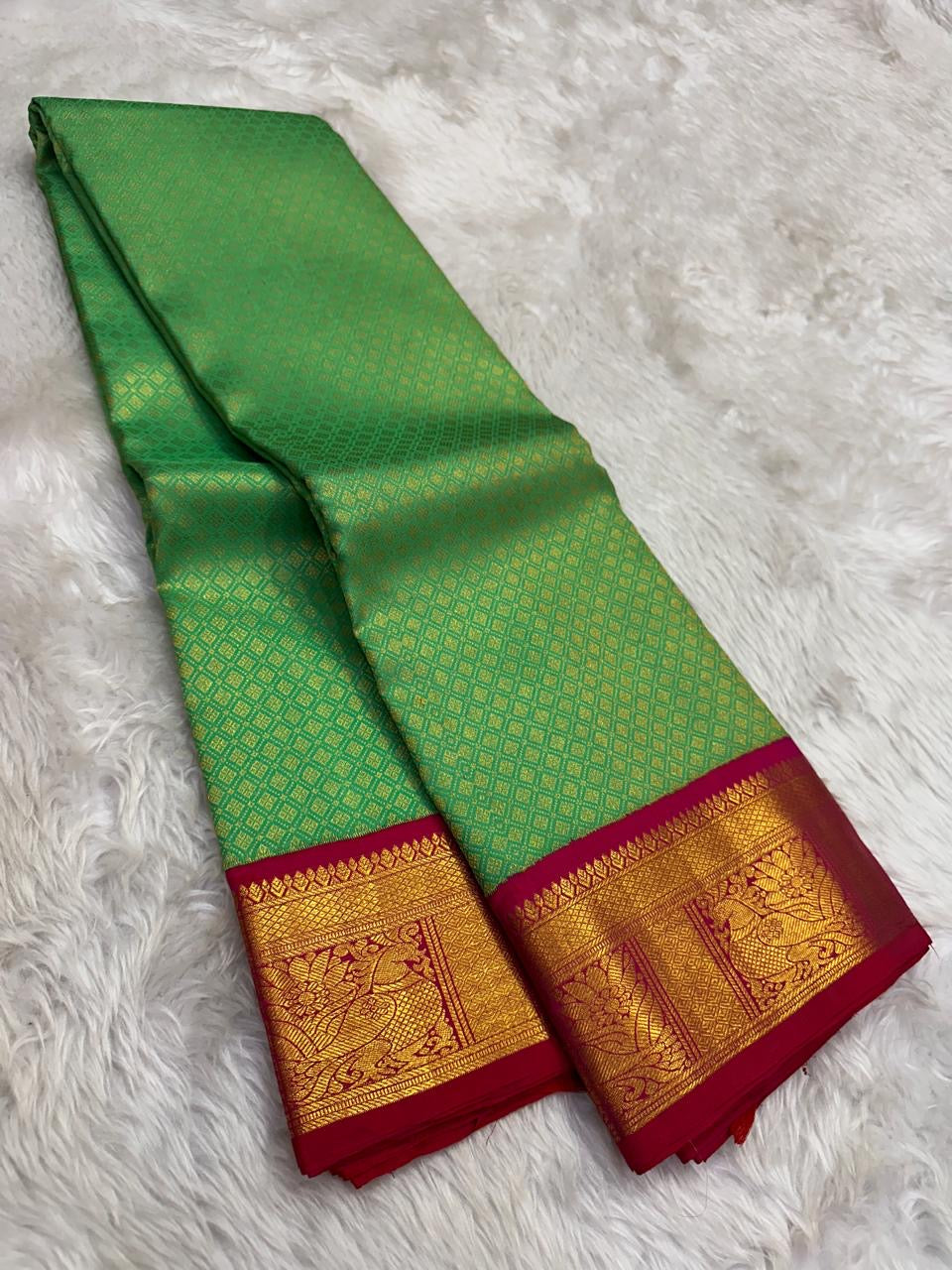 Sea-green Zari Kattam silk with rani pink gold brocade border and contrasting coral pallu