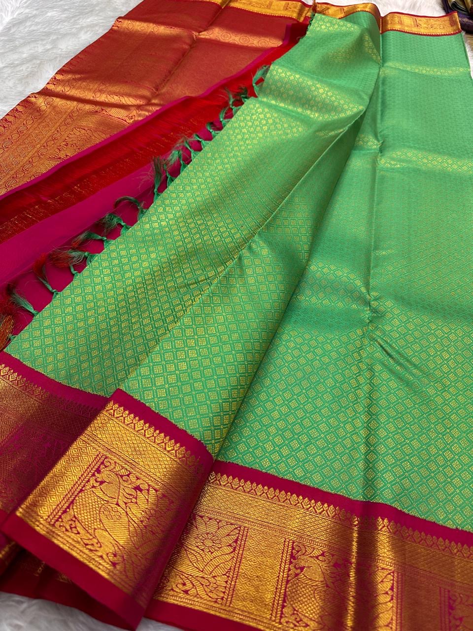 Tiny gold zari grid woven throughout fresh aqua-green Kanjeevaram pure silk body