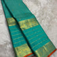 Sea Green pure silk Kanjivaram Varisaipet saree with antique-gold traditional zari border.