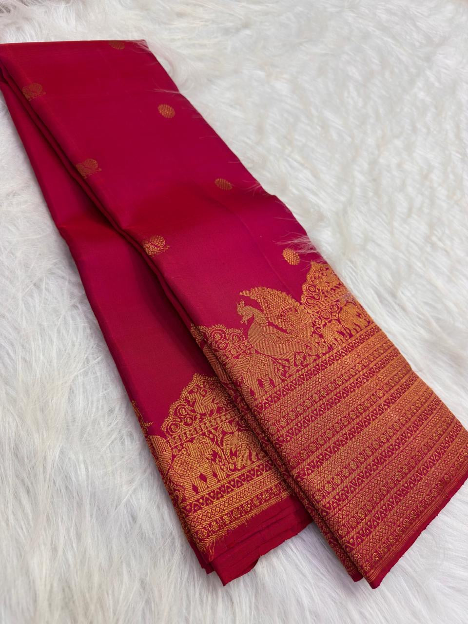 Orange and pink shot-colour Kanjipuram silk saree with shimmering gold zari
