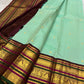 Close-up of seafoam green silk body with scattered gold zari coin butta motifs