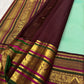 Deep green pallu with full ornate Varisaipet array — elephant, peacock, and floral zari motifs