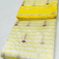 Moonlit ivory and marigold yellow Chanderi Pattu Silk saree, alternate view of the luminous ivory body and botanical motifs.