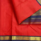 Deep vibrant red Pure Silk Kanchipuram Rettapet saree with neelam-blue border and luminous zari kattam.