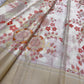 Ivory Kanchi Pattu saree with dusty rose coral sage and antique-gold handwoven floral motifs.