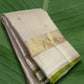Vanilla ivory Kanchipuram silk saree with zari kattam checks and green selvedge