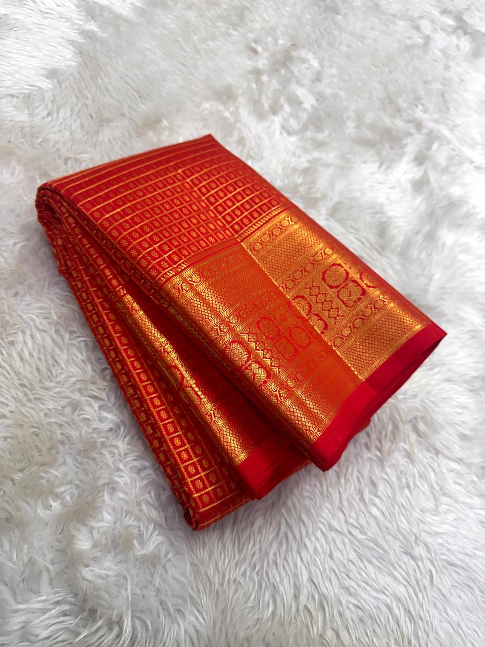 Exceptionally fine gold Zari Kattam with minute buttas on Sevappu Red silk.