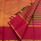Close view of fine silk-thread and golden lines in the Vazhaipoo striped body of the vintage vermilion Kanchipuram saree
