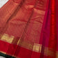 Handwoven raspberry and vermilion Kanchipuram Zari Kattam saree displayed with its elaborate gold zari border and pallu.