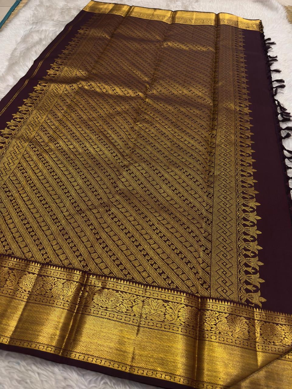 Silk Mark certified Kanjivaram saree with mayil kodi border in brown purple