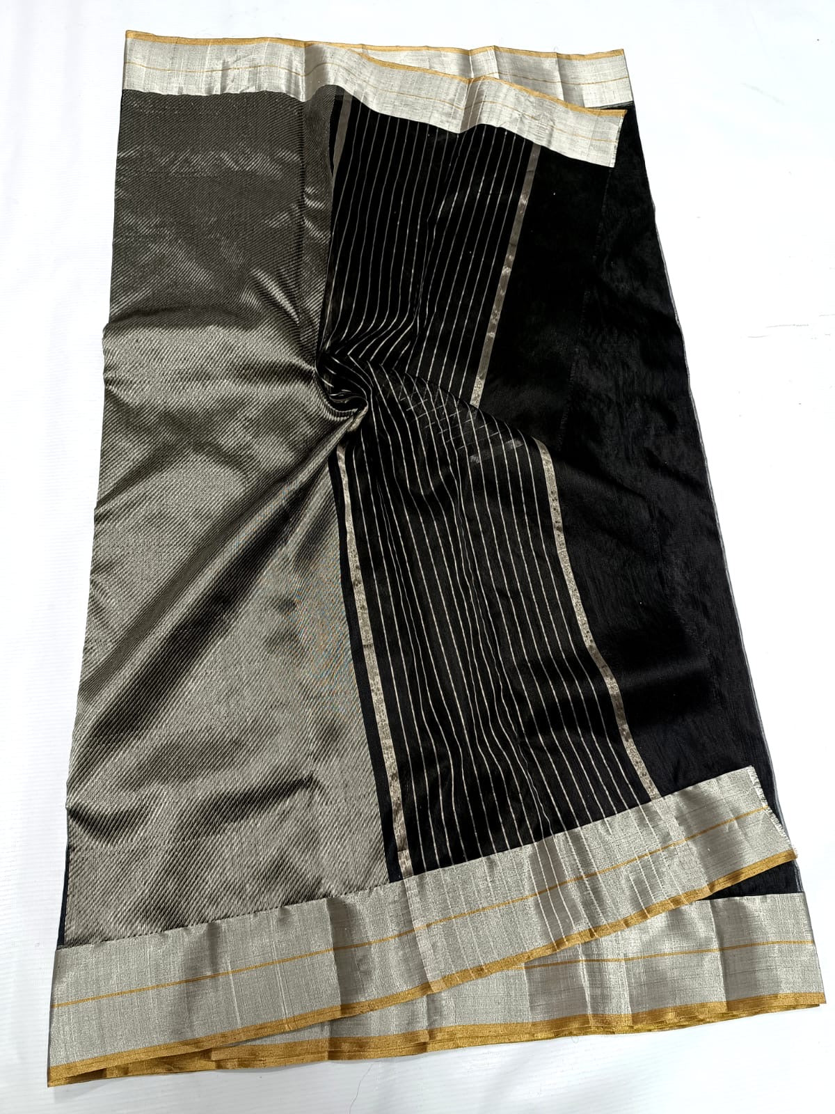 Close-up of silver-toned floral motif on black Chanderi silk