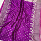 Close-up of the silver-woven deer and palm border on the Royal Purple Chanderi saree