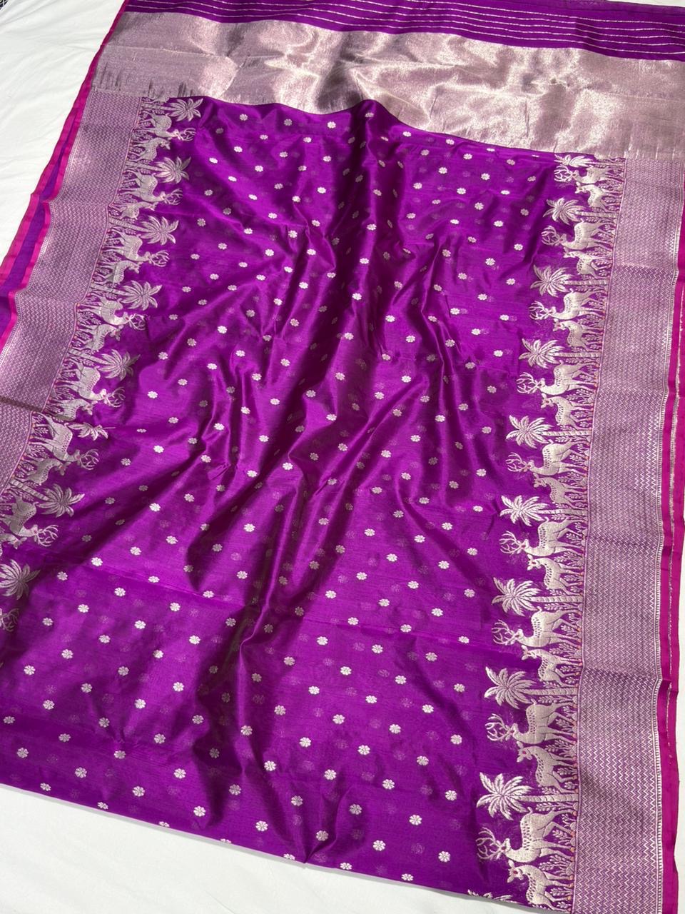 Close-up of the silver-woven deer and palm border on the Royal Purple Chanderi saree
