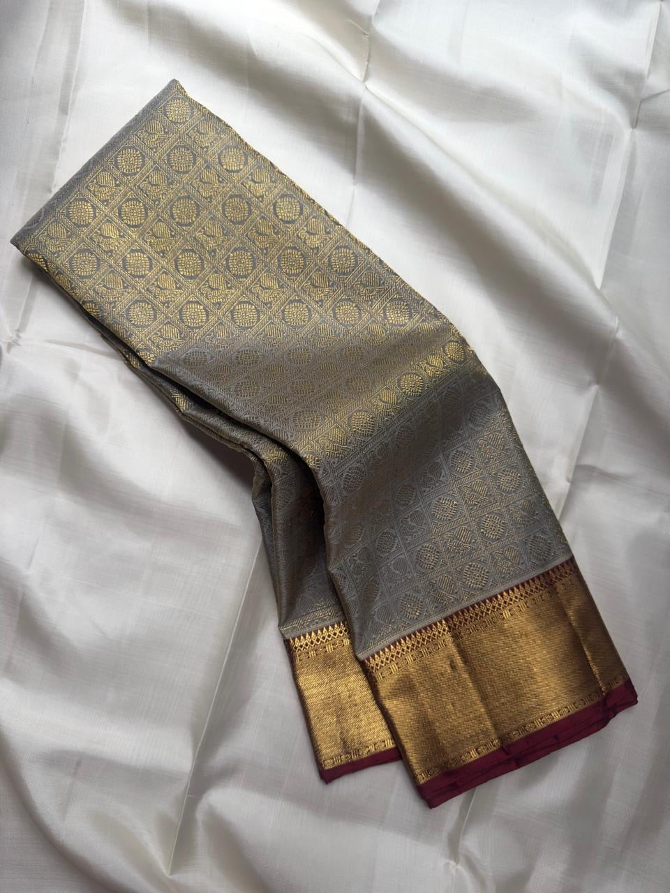 Silver Grey pure silk Kanjeevaram Korvai saree with broad gold zari border.