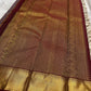 Silver Grey pure mulberry silk saree with repeating gold zari medallion lattice.