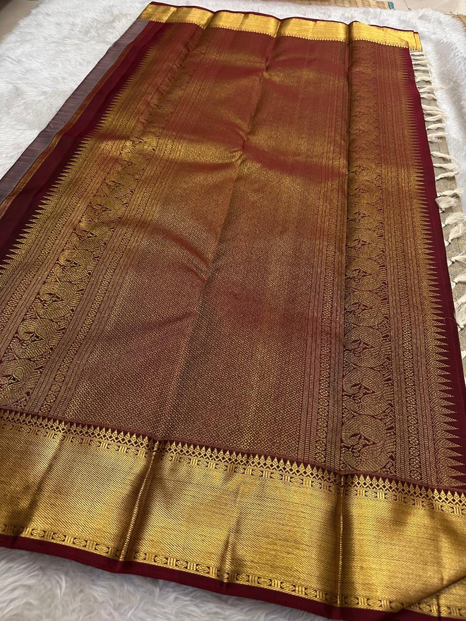 Silver Grey pure mulberry silk saree with repeating gold zari medallion lattice.