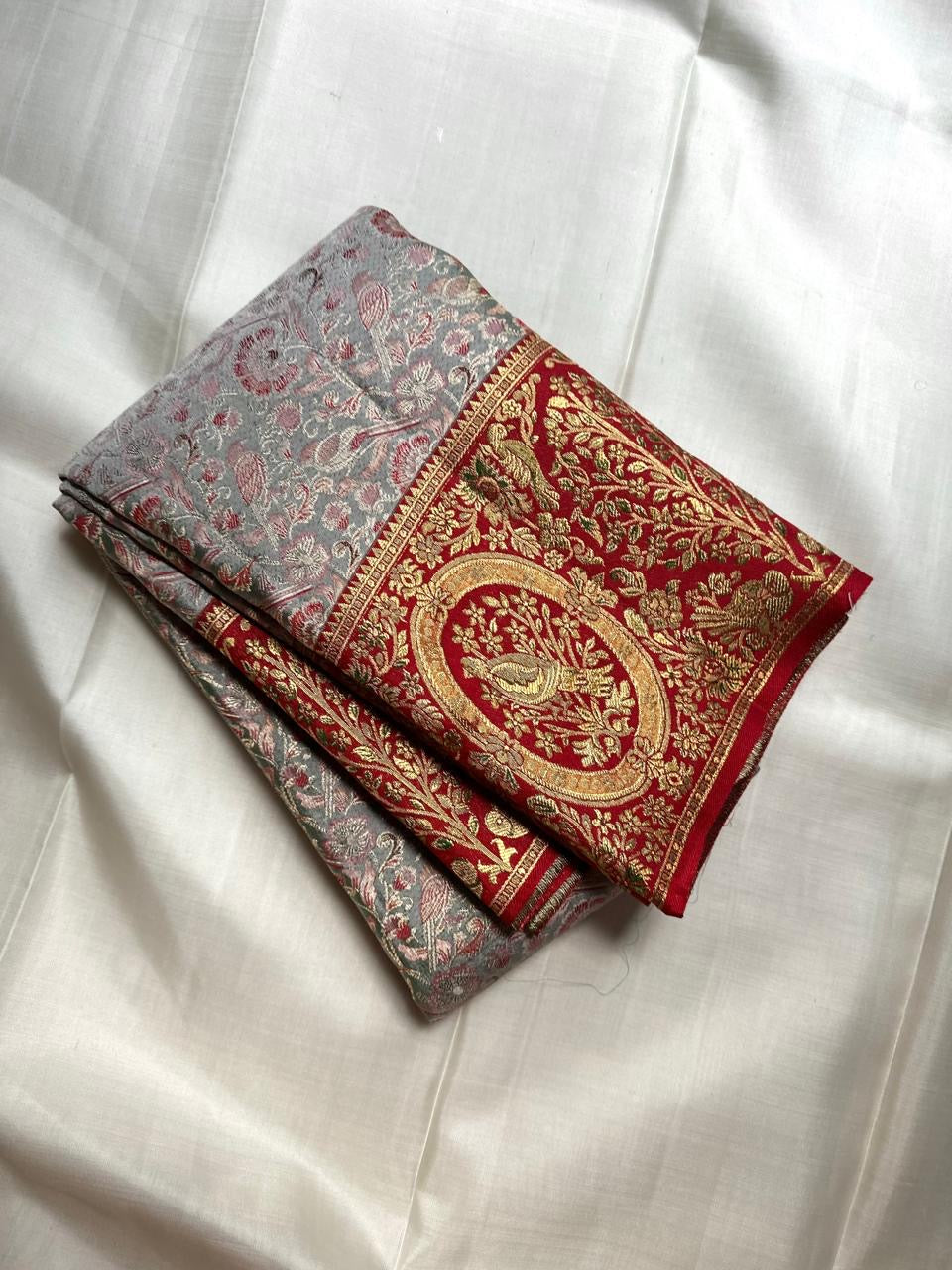 Arakku Red gold zari border with bird medallions and flowering trees on Silver Grey Kanchipuram silk.
