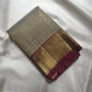 Silver Grey and Arakku Red Korvai Kanjeevaram saree with rich gold zari.