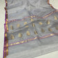 Silver grey handloom Katan Silk Chanderi saree draped to show body and border
