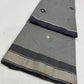 Silver grey handwoven Chanderi saree with black-and-silver buttas