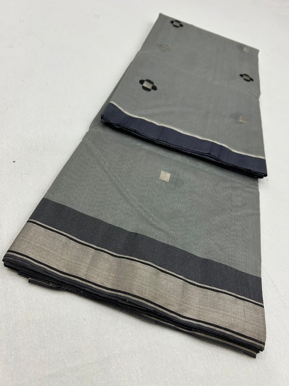 Silver grey handwoven Chanderi saree with black-and-silver buttas