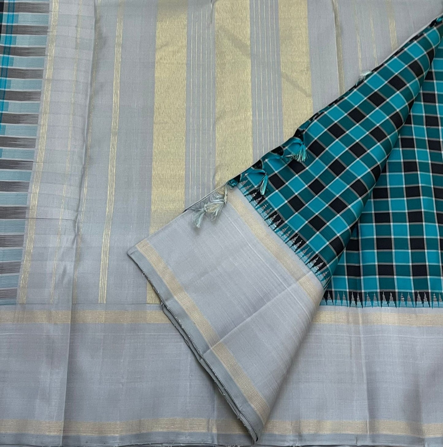Full spread teal checked Pure Kanchipuram silk saree with silver grey pallu and zari woven panels, available in the USA