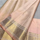 Silver Grey Kanchipuram silk saree with Soft Peach Pink contrast and traditional zari buttas.