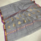 Silver grey Chanderi saree with a narrow purple border and gold zari bands
