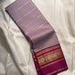Silver lilac Kancheepuram silk saree with dense gold zari pallu framed in magenta