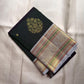 Green Floral-Chakram bands and Arakku accents on silver zari Kanchipuram border