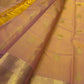 Sunset orange Kancheepuram silk saree with zari buttas, folded with running blouse piece