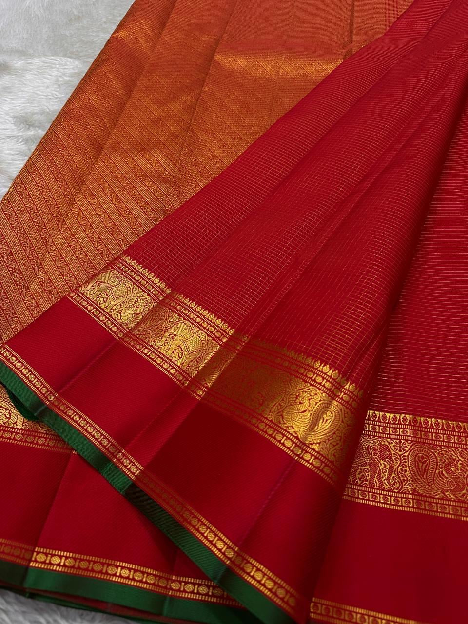 Narrow green selvedge detail framing the red edge of Pure Silk Kanjipuram saree