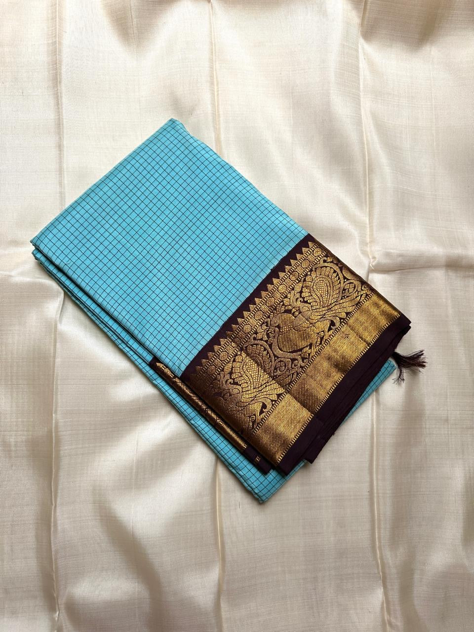 Kanchipattu silk saree in sky blue with cocoa brown border Kanchi Kattam Korvai weave traditional zari detail