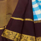 Deep-brown peacock and Kodi Malar zari border on a sky blue and ivory Kanchipuram saree.