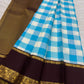 Sky blue and ivory checks of a Paalum Pazhamum Kanchipuram saree.