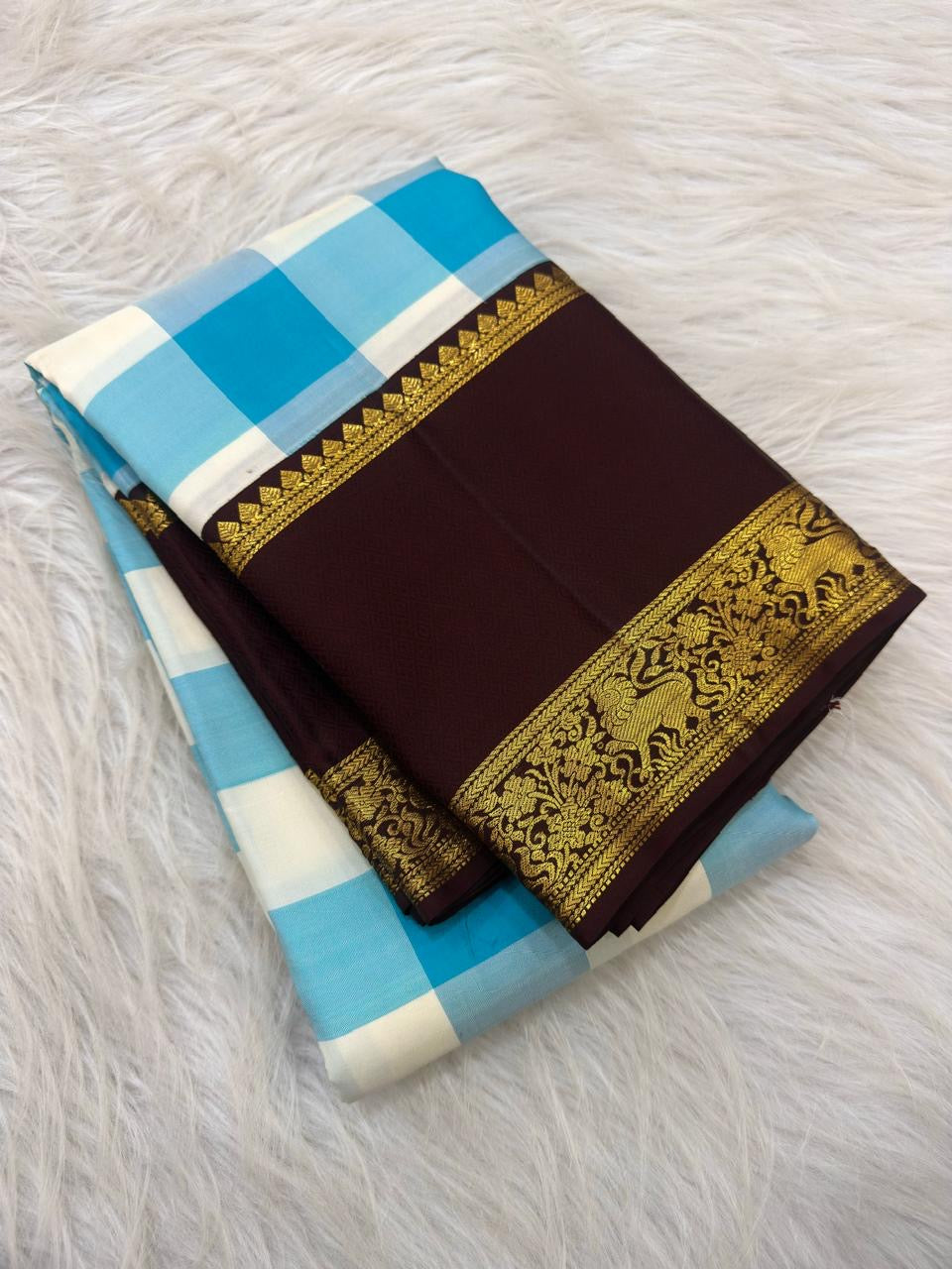 Sky blue and ivory Pure Silk Kanchipuram saree with traditional checks.