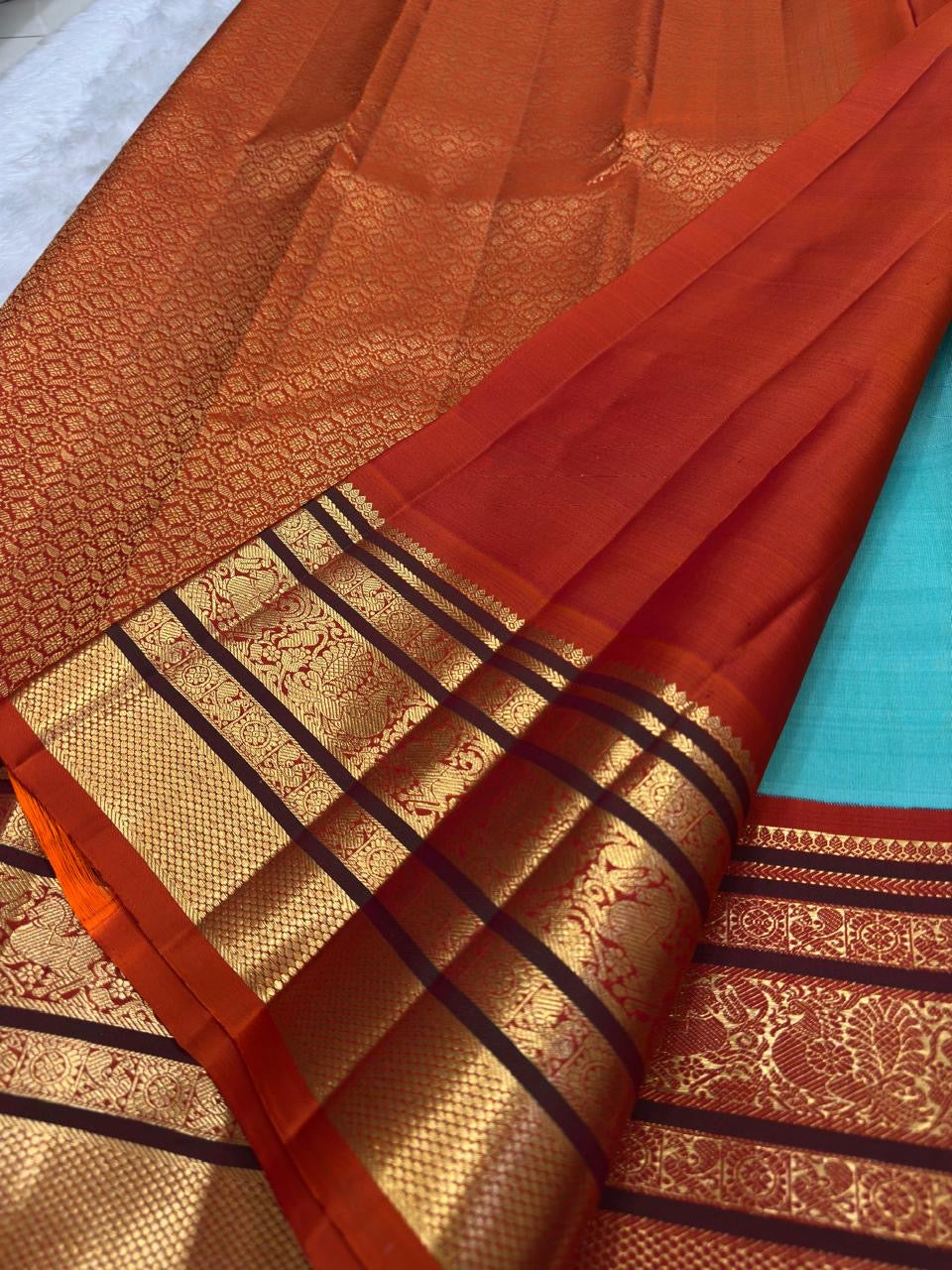 Sky blue Kancheepuram silk saree with Varisaipet weave and burnt orange zari border — Idam Living