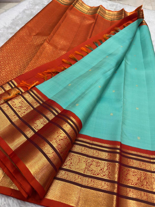 Sky blue Kanjeevaram saree with Varisaipet weave and rust orange ornate zari border — Idam Living