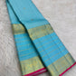 Light aqua blue Kanchipuram silk saree with rich antique-gold Varisaipet weaving.