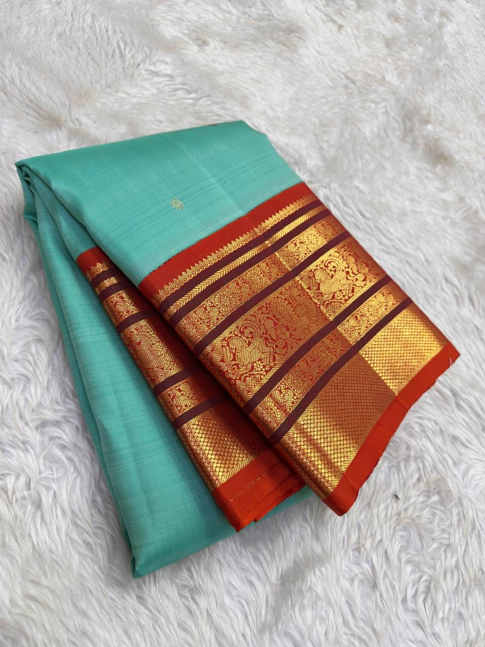 Sky blue rust orange Kanchipuram silk saree with Varisaipet weave and ornate zari border — Idam Living
