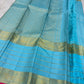 Close view of antique-gold traditional zari motifs woven against Sky Blue Kanjivaram silk.