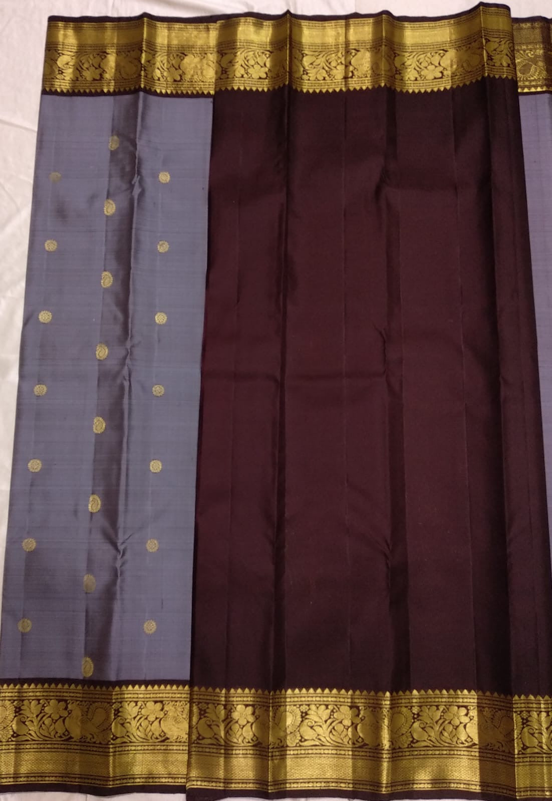 Full layout of slate-grey Butta silk saree and densely woven Kaapi Brown peacock zari pallu