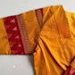 Artisan yellow blouse with handloom ikkat patterns and rich woven detailing by Idam Living