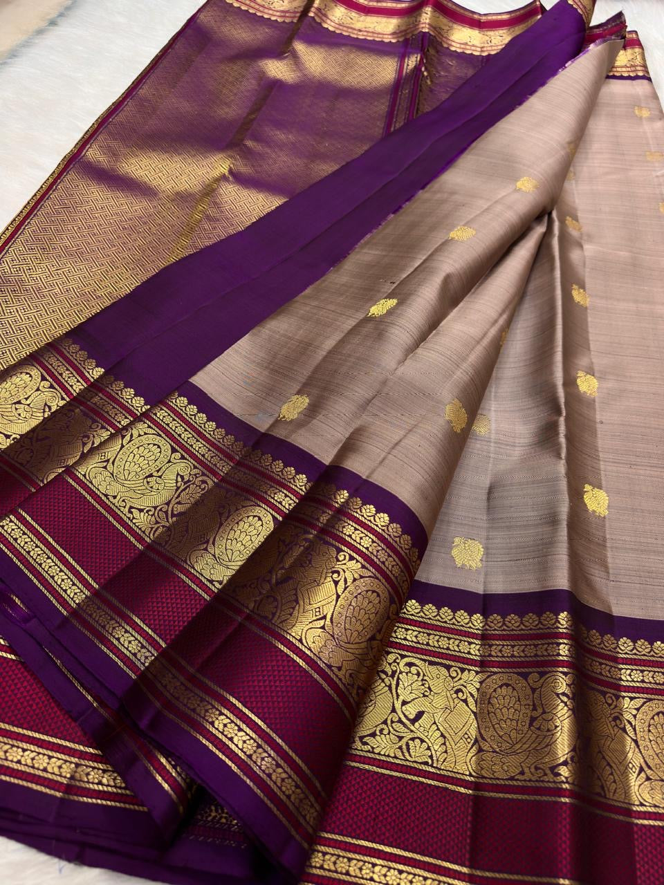 Deep Purple and raspberry Varisaipet border with large gold Mayil motifs on pure Kanjipuram silk.