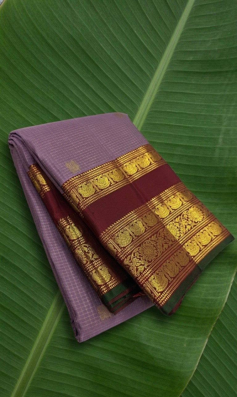 Kanchipuram silk saree in smoky lavender with deep maroon border Varisaipet Korvai weave folded view