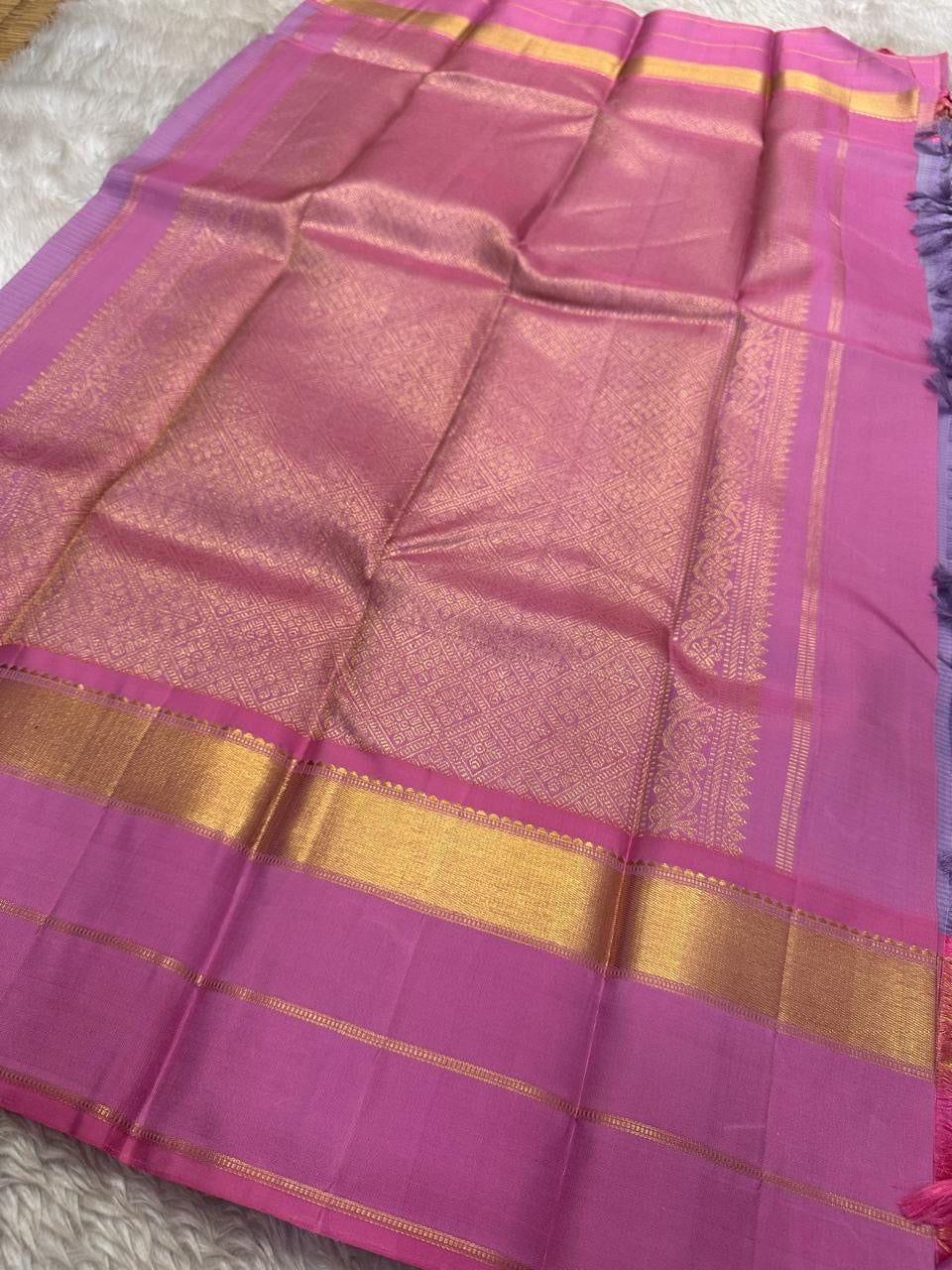 Kanchipattu silk saree in smoky lilac with raspberry pink border Korvai Kaal Irangiya Border weave traditional zari detail