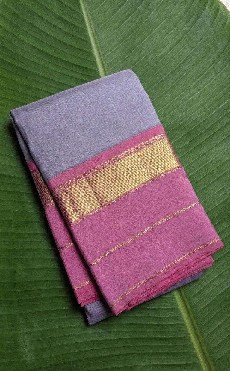 Kanchipuram silk saree in smoky lilac with raspberry pink border Korvai Kaal Irangiya Border weave folded view