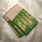 Soft ivory handwoven pure silk Kanjipuram saree with emerald green Korvai peacock border, full view