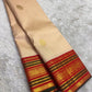 Soft Champagne Ivory Kanchi Pattu Saree — body close-up showing circular gold zari buttas